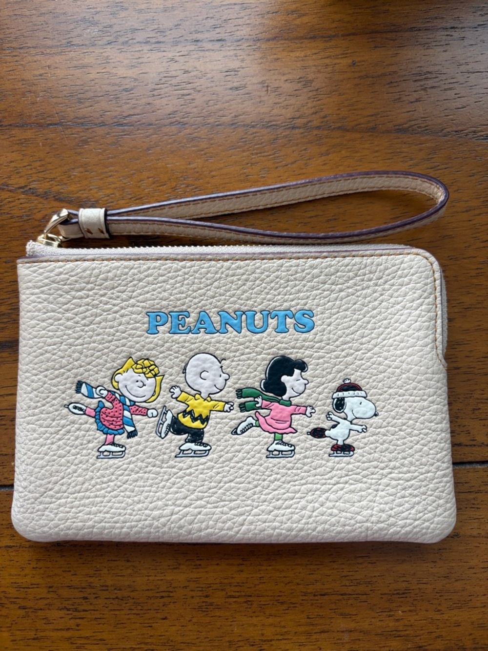 Coach Cream Peanuts Ice Skating Wristlet